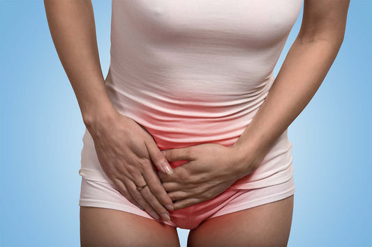 Woman holding lower abdomen due to vaginal pain